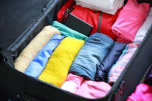 how to put clothes in a suitcase